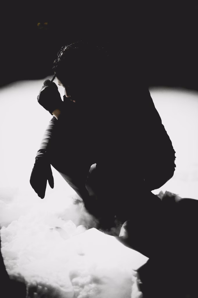 Pilgrim in snow — crouching